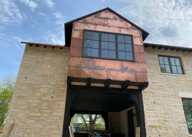 Copper metal panel facade on a stone building for Metal Roof Coating in Carson City