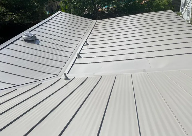 Solar attic fan installed on a metal roof for Roof Ventilation in Carson City